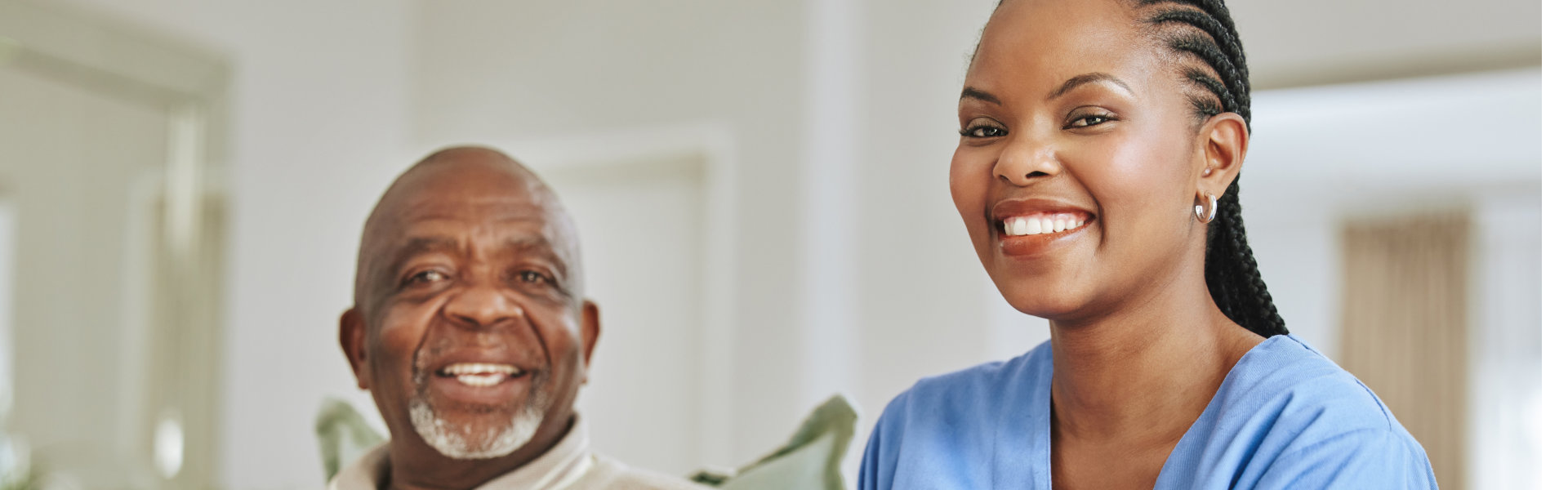 senior man and caregiver smiling